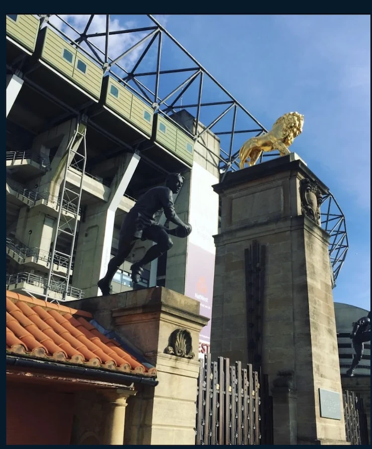 Rugby stadium exterior with golden lion